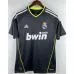 Camiseta retro del Real Madrid  2010/11 fuera de casa - Negro